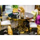Złoty stół z ażurową podstawą i czarnym szklanym blatem 120x76 cm TH404
